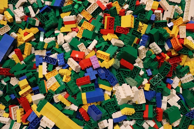 happy children playing with colorful educational building blocks and STEM toys in a bright learning environment